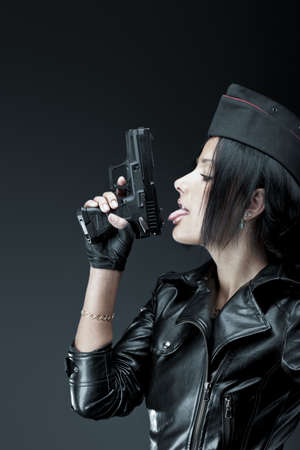 5946497-beautiful-woman-licking-black-handgun.jpg