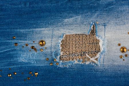 34536909-light-blue-ripped-jeans-with-rhinestones-and-gold-thread-with-space-for-your-text.jpg