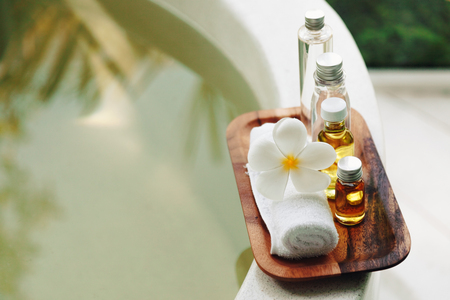spa decoration, natural organic bath products on a wooden tray spa decoration, natural organic bath products on a wooden tray