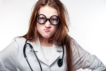 funny doctor: Funny doctor holding a pill