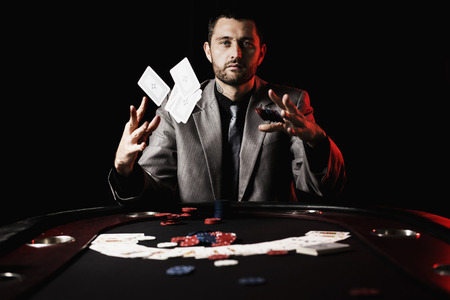 poker: Concept: A high stakes poker player is frustrated and emotional over loosing and finding it hard to contain his emotions. Cinematic portrait.