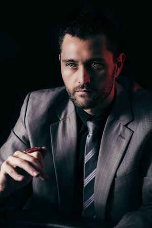 poker: Concept: A high stakes poker player is frustrated and emotional over loosing and finding it hard to contain his emotions. Cinematic portrait.