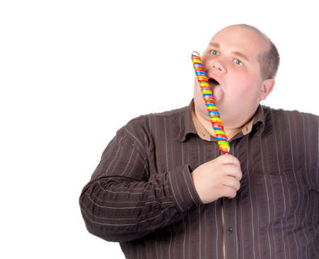 15869786-fat-obese-man-enjoying-a-a-long-colourful-striped-lollipop-standing-licking-it-with-a-look-of-comple.jpg