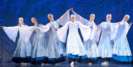 28923536-girls-in-white-dresses-dancing-