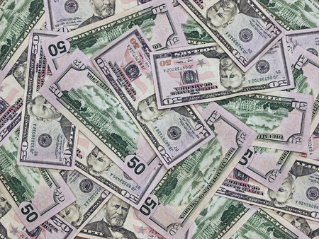 25544261-a-pile-of-fifty-dollar-bills-as-a-money.jpg