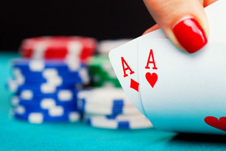 poker: Two aces and gambling chips Stock Photo
