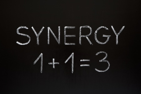 Synergy concept 1+1=3 made with white chalk on a blackboard.  Stock Photo - 13102172