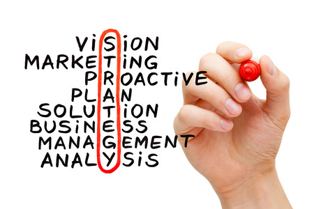 Hand writing Strategy crossword with marker on transparent wipe board. photo