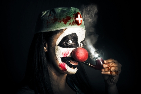 22813216-fine-art-horror-portrait-of-a-bad-surgeon-clown-smoking-pipe-after-blood-surgery.jpg