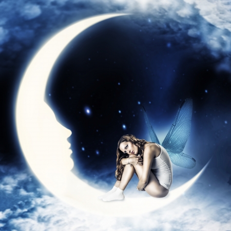 Beautiful woman fairy with wings sitting on moon with face in the star and clouds  sky Stock Photo - 19559192
