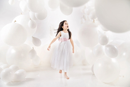 balloon: Delighted kid among numerous balloons