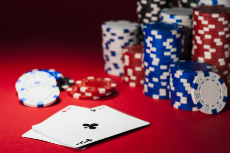 poker: cards and poker chips on a red cloth