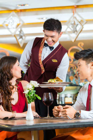 26792293-asian-chinese-couple--man-and-woman--or-lovers-having-a-date-or-romantic-dinner-in-a-fancy-restauran.jpg