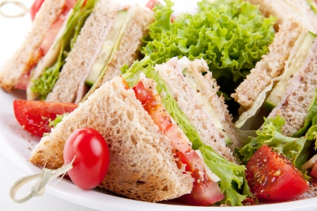 fresh tasty club sandwich with lettuce cheese ham and toast isolated on white background Stock Photo