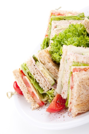 fresh tasty club sandwich with lettuce cheese ham and toast isolated on white background Stock Photo
