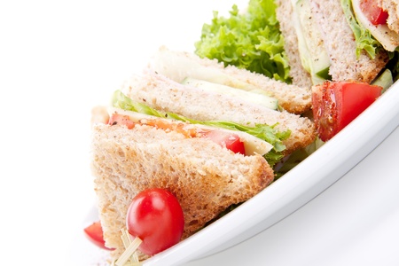 fresh tasty club sandwich with lettuce cheese ham and toast isolated on white background Stock Photo