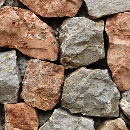 20610175-large-rough-hewn-natural-stones-and-rocks-interlocked-without-mortar-forming-a-garden-wall.jpg