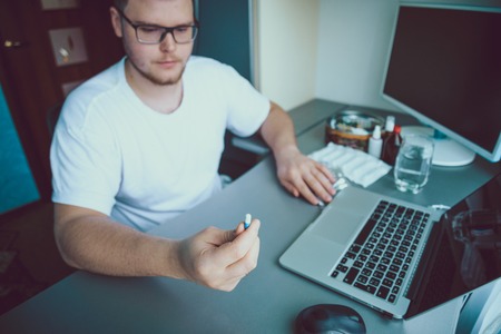 [Imagen: 68815200-man-sitting-and-looking-on-pill....jpg?ver=6]