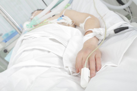 Patient in a hospital bed  Stock Photo - 27538334