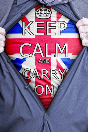 A British businessman rips open his shirt and shows a catchy slogan printed on a t-shirt Stock Photo