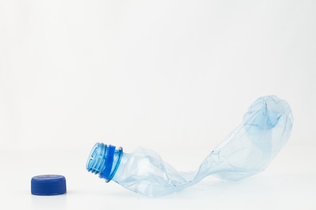 16069487-empty-plastic-bottle-crushed-and-blue-cap-to-recycle.jpg