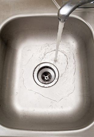 26035456-close-up-shot-of-sink-with-wate