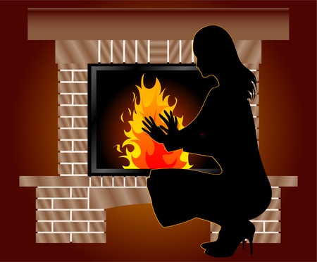 La mujer se calienta cerca de chimenea. Foto de archivo. La mujer se calienta cerca de chimenea. Foto de archivo.
