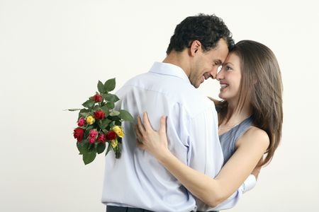 Woman hugging man for giving her a bouquet of flowers - 2966294