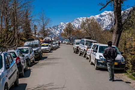 Manali, himachal pradesh, india - may 01, 2019 : photo of tourist and vehicle in gulaba. road to rohtang pass in himalayas Stock Photo