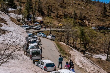 Manali, himachal pradesh, india - may 01, 2019 : photo of tourist and vehicle in gulaba. road to rohtang pass in himalayas Stock Photo