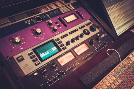 Close Up Professional Audio Equipment With Sliders And Knobs At Boutique Recording Studio Stock Close Up Professional Audio Equipment With Sliders And Knobs At Boutique Recording Studio Stock