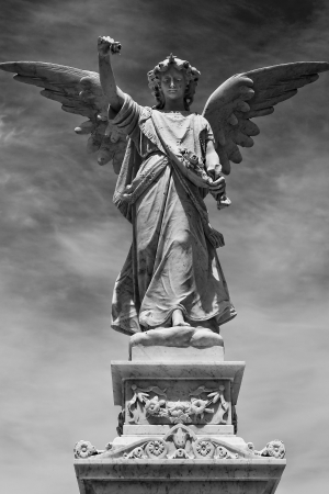 black and white angel statue with wings out stretched stock photo