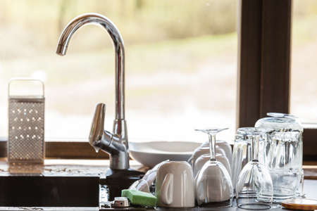 kitchen counter window bifold modern sink and kitchen counter with claen dishwares window in the background washing up sink and kitchen counter with claen dishwares kitchen counter window bifold modern sink and kitchen counter with claen dishwares window in the background washing up sink and kitchen counter with claen dishwares