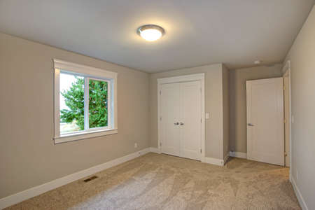 New Construction Home Interior Features Empty Room With Beige