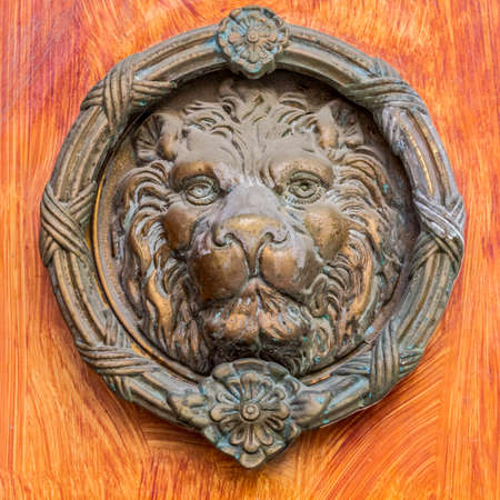 Vintage Brass Door Knocker - Lion Head, Decorative Detail On.. Stock Stock Photo - Vintage brass door knocker - lion head, decorative detail on the front door - Vintage Brass Door Knocker - Lion Head, Decorative Detail On.. Stock