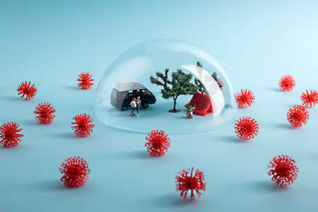 Creative coronavirus layout made with people camping under the glass dome, surrounded by virus. minimal stay at home wallpaper. self-isolation and coronavirus pandemic concept. Фото со стока