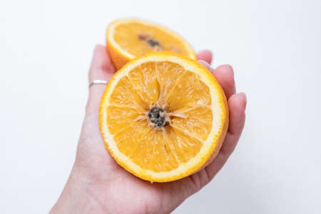 Spoiled orange. the black middle inside the fruit Stock Photo