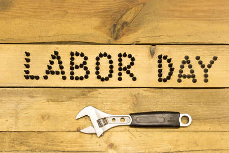 Labor day different tools on a wooden table