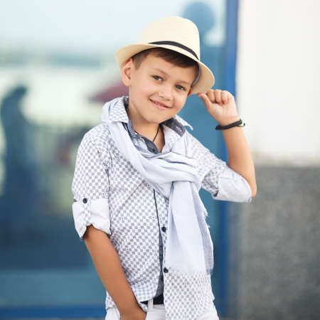 stylish baby boy having fun outside in the park cute happy boy