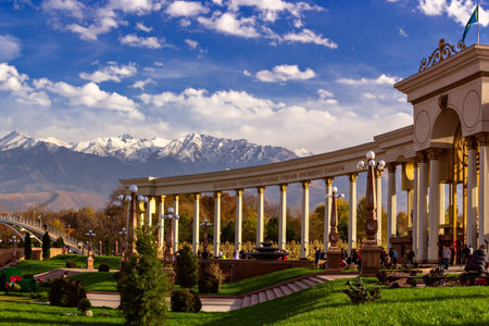 Almaty, Kazakhstan - October 27, 2014 Mountain View from the colonnade city park. Park of the first president in Almaty - a favorite place of citizens at any time of the year. In summer it is hold festivals and holidays Редакционное