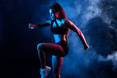 Talented woman dancing in the night club, performance, entertainment. close up side view photo. isolated black background, studio shot Banco de Imagens