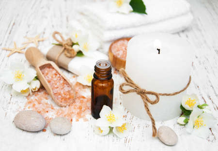 Spa concept with jasmine flowers on a old wooden background