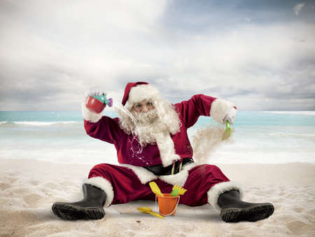 Santa claus enjoys playing on the beach Stock Photo