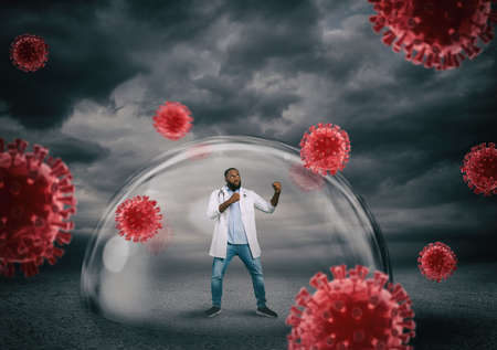 Doctor safely inside a shield dome that protects him from virus. protection and safety concept Фото со стока