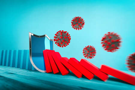 Shield stops a chain fall caused by viruses like domino game. concept of preventing crisis and failure in business and healthcare.
