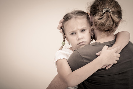 sad lonely: sad daughter hugging his mother