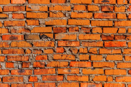 ひびの入った色のレンガの大まかなれんが造りの壁の基礎 の写真素材 画像素材 Image