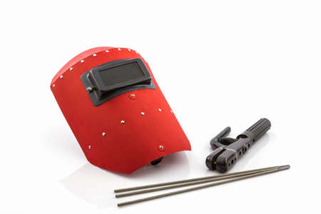 Red protective screen and rod-holder with Welding electrodes wire, for electric arc welding, on white background.