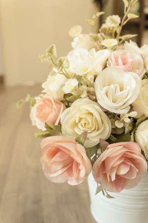 Decorative sweet flower in vase on the table at Cafe.