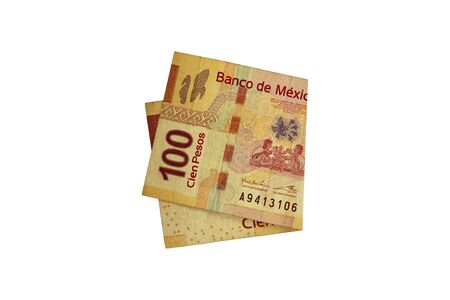 A single middle folded 100 mexican peso bill isolated and on white background